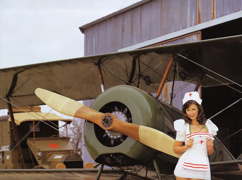 beautiful nurse with a propeller plane