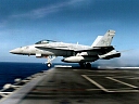 f-18 hornet launching off aircraft carrier