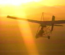 ultralight flying at sunset