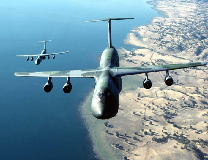 c5 flying with c141 cargo military aircraft