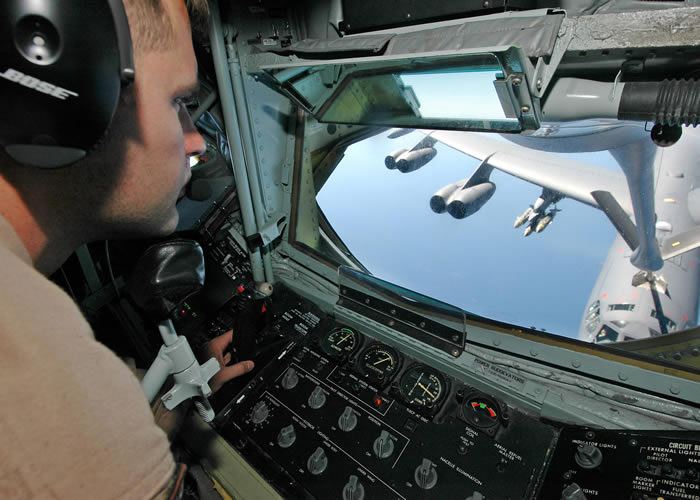 Boom operator of kc-135 refuels a b-52 in the air