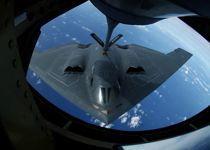 B-2 USAF Stealth Bomber Being Refueled over Ocean By A KC-135