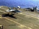 f-18 aircraft landing on aircraft carrier