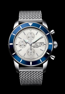 silver and blue breitling watch