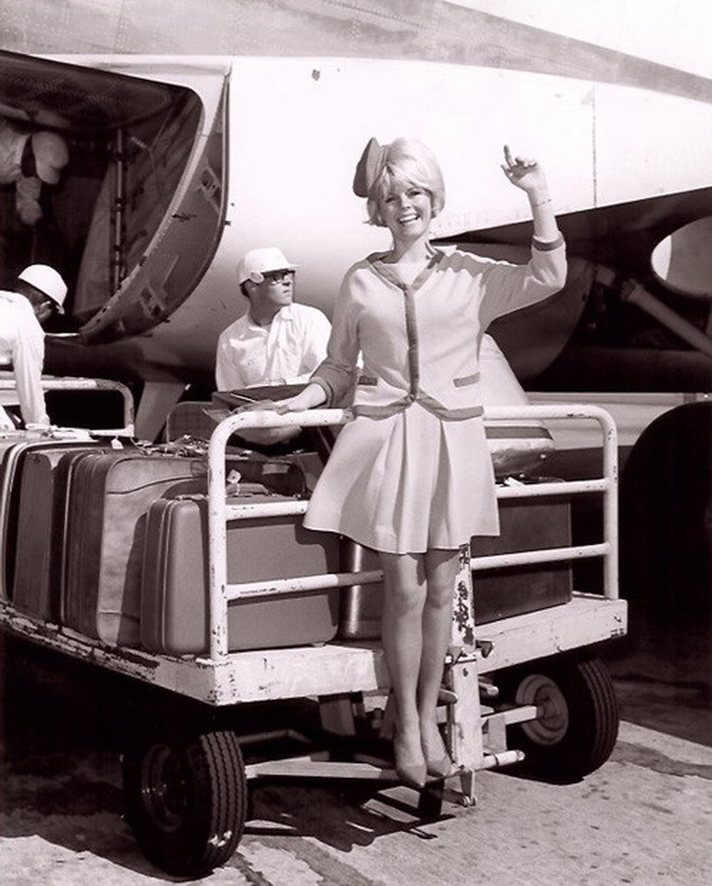 flight attendant on baggage cart