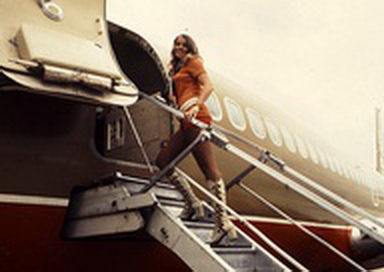 flight attendant walking up stairs from southwest airlines