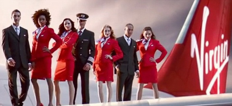 flight attendants from virgin airlines on aircraft wing